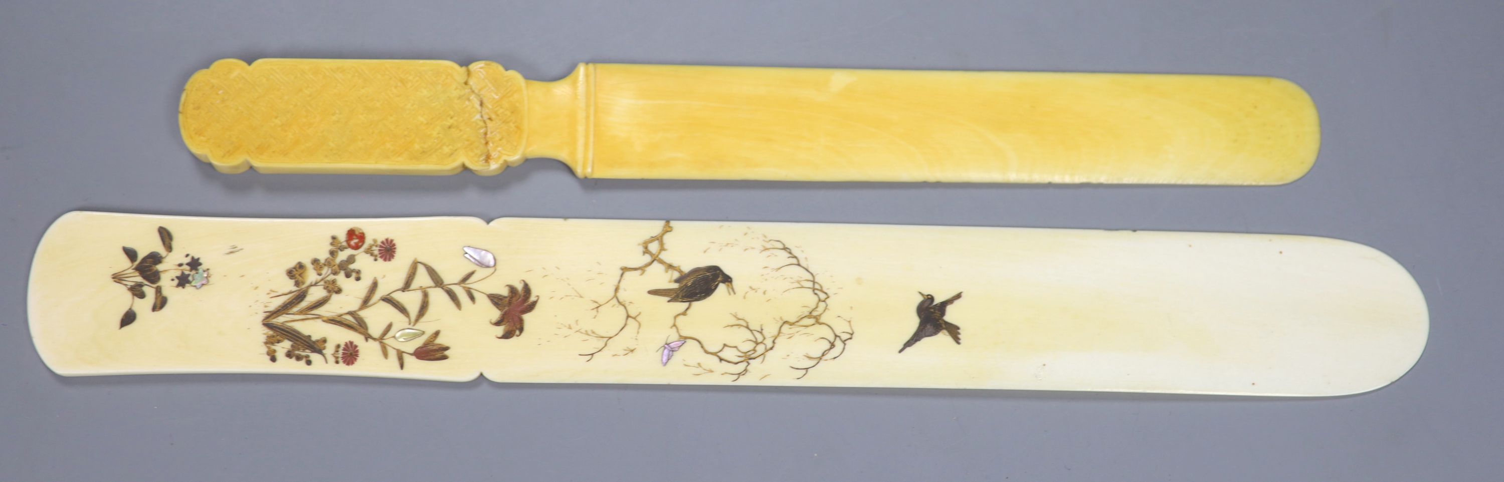 A Meiji period Japanese shibayama style ivory page turner, decorated with birds, flowers and butterflies, 30.5cm long,